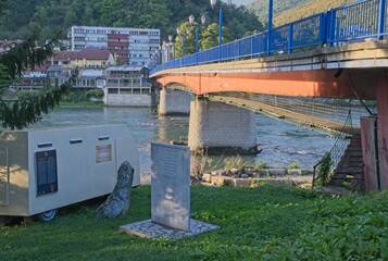 Gorazde, Bosnia and Herzegovina - Sep 29, 2023: This pedestrians bridge under another bridge was built in the Bosnia War to protect pedestrians against snipers when crossing the river. Selective focus - obrazy, fototapety, plakaty