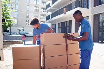 Movers Checking Delivery Boxes