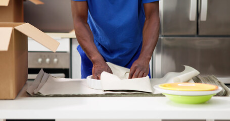 Packing Dishes In Home Apartment Room