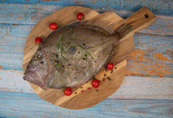 Saint-Pierre Seafish, Zeus Faber, John Dory, Pez de San Pedro, fish, isolated on cutting board background. High quality photo