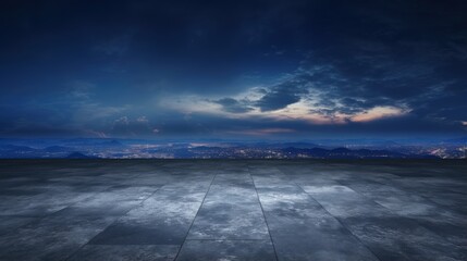 Scenic night sky with dramatic clouds above a dark concrete floor background