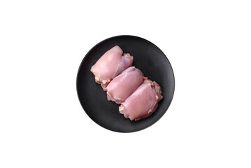 Fresh raw chicken thigh fillets with salt, spices and herbs