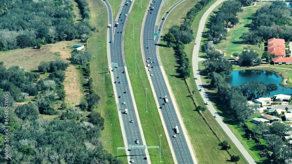 Wall mural Aerial view of busy american highway with fast moving traffic. Interstate transportation concept - Wall murals