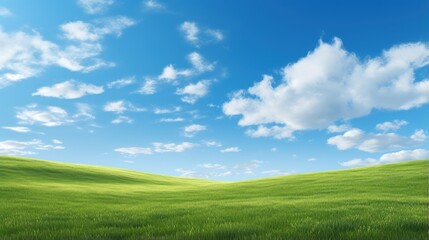 Obraz premium Grassy hills under blue sky with clouds