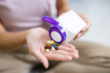 Closeup photo of supplements with a white bottle