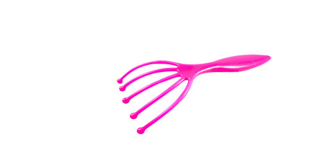 pink color plastic head scratch device in white background