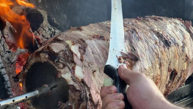 Cag kebab, a traditional Turkish dish cooked over a fire , Turkish fast food meat. High quality 4k footage