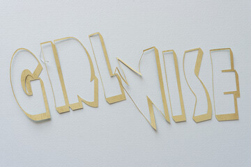 machine-cut letter outlines (spells the word 