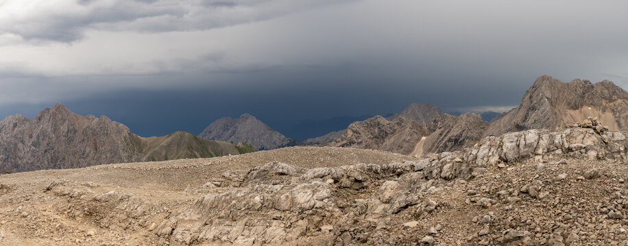 Panoramic scene of a thunderstorm over the Wetterstein mountains in the Alps