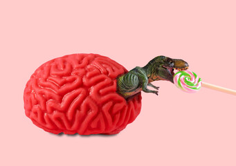 Human brain from which dinosaur climbs out eating lollipop. Feeding the brain with carbohydrates...