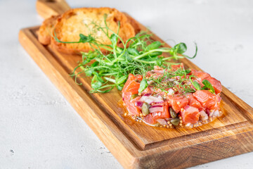Portion of salmon tartare