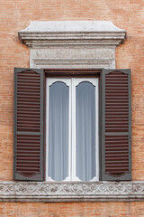Old window with shutters in Rome