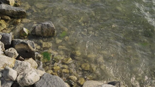 Slow motion closeup shot of clear water waves of a lake