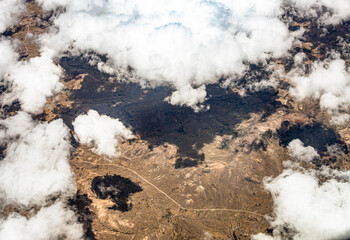 View from 10,000 meters (33,000 feet) of the mountains and arid landscape of western Peru. Dry...