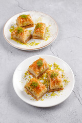 Turkish-style pistachio baklava with a glass of milk.