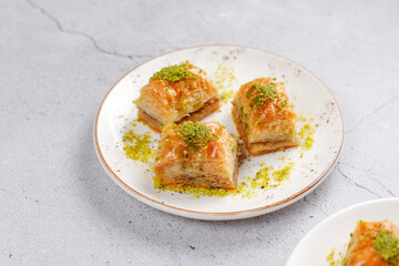 Turkish-style pistachio baklava with a glass of milk.