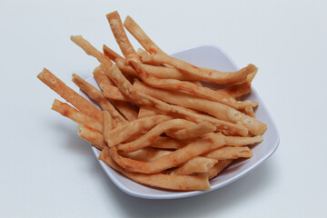 Cheese stick snacks, in a white bowl, isolated on white background
