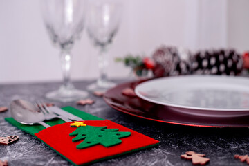 Nice Christmas table setting on black and white background, top view