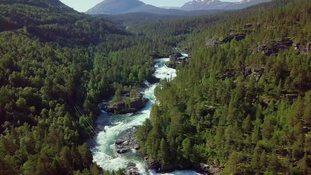 Aerial view of a mountain river in Norway. Beautiful summer landscape (camera down).