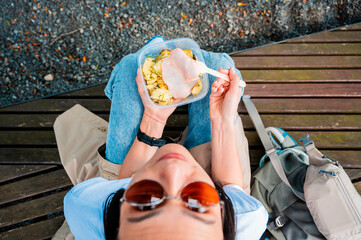 Woman chewing eating lunch outdoor close up. Street food. 