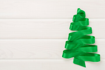 Creative handmade christmas tree on wooden background, top, view