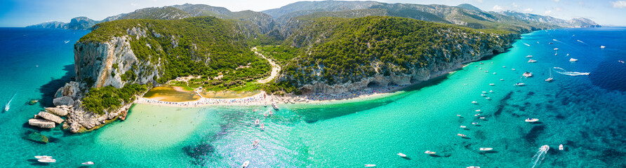 Drone view of the vibrant Cala Luna Beach on Sardinia island, Italy - 654937881