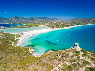 Aerial view of Porto Giunco beach and tower in Villasimius, Sardinia, Italy