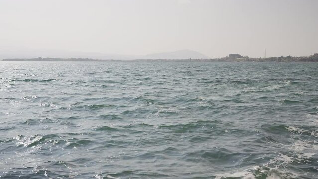 Slow motion closeup shot of clear water waves of a lake