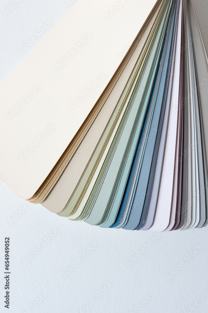 Canvas Prints paint-chip sample book with analogous color schemes on blank paper