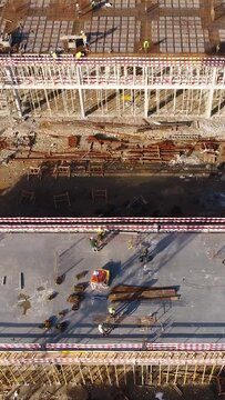 Vertical Video of Construction Workers in the Roof of New Building 