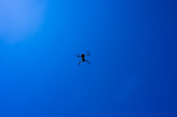 Drone on sky blue background isolated. Copy space.