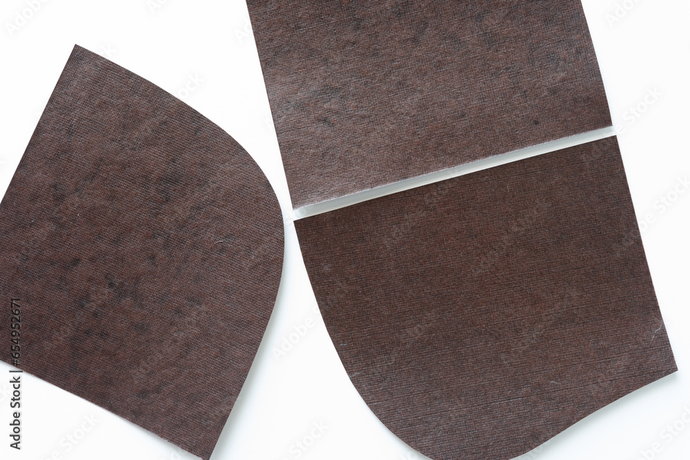 Sticker three rounded shaped brown paper pieces on white