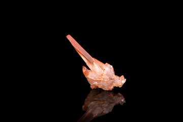 orange Hematoid quartz isolated on black background. macro detail close-up rough raw unpolished...