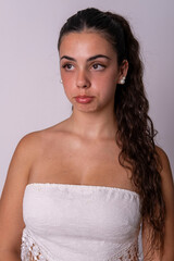 "Young Caucasian Woman Wearing a Heartfelt Expression of Profound Sadness, Conveying Deep Emotion Through Her Face."