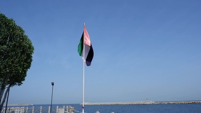 UAE flag on the beach pier in Sharjah