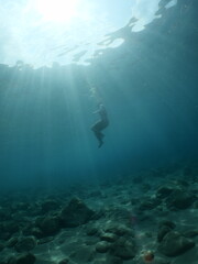 Fototapeta na wymiar free diving underwater sun beams and rays