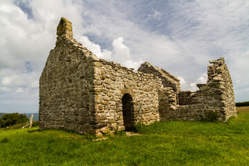 Beautiful old welsh chapel or church, ruin, sky as copyspace top. - 654997859