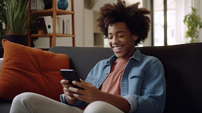 young black woman smiles as she uses her phone in modern tv spot style image