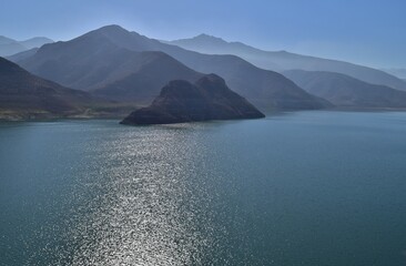Reservoir in Elqui Valley, Chile: Man-made water body amid scenic landscapes, offering irrigation, recreation, and vital water resources.