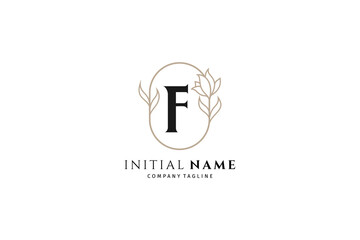 Initial letter f with oval frame decorated with flowers is suitable for fashion, beauty and jewelry industry font text, wedding invitations