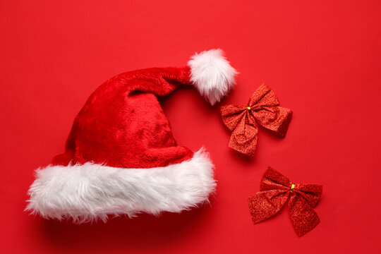 Santa hat with bows on red background