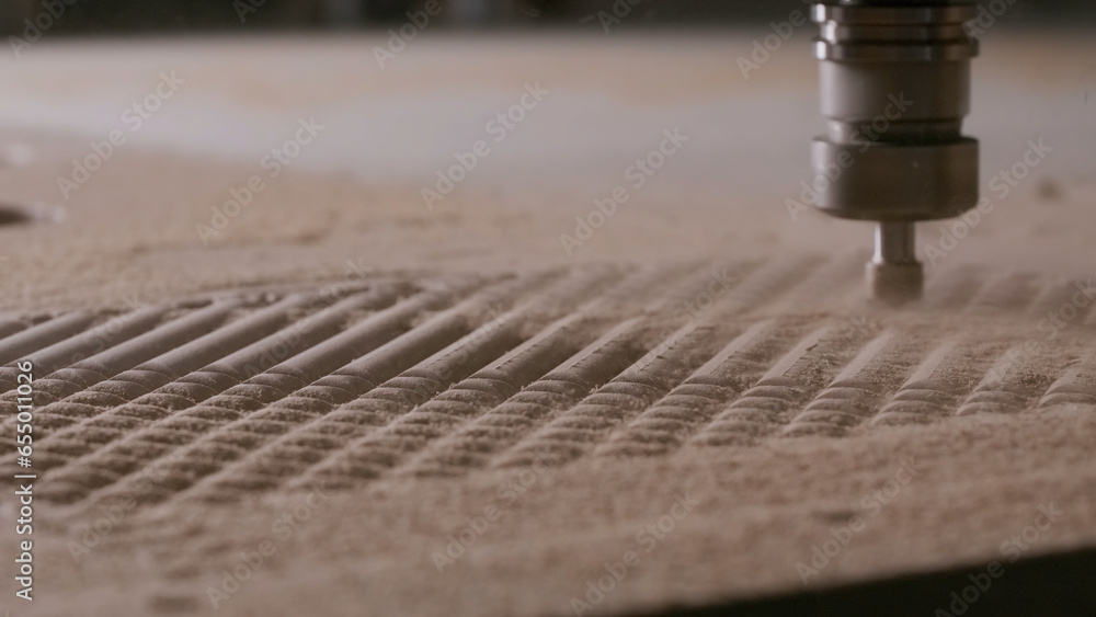 Aufkleber engraving machine carving wood board. creative. automatic machine cutting wooden surface and creatin