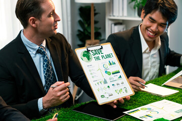 Diverse group of business people planning business marketing with environmental responsibility for...
