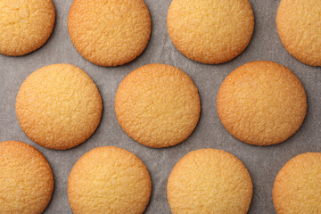 Delicious Danish butter cookies on baking tray, flat lay
