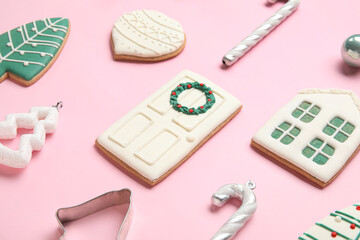 Composition with different Christmas cookies and decorations on pink background