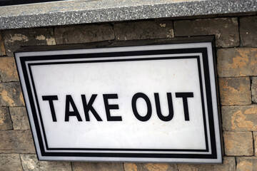 Take-out acrylic sign posted in front of the coffee shop