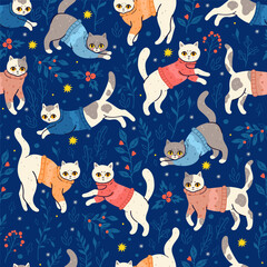 Seamless pattern with winter cats in sweaters. Vector graphics.