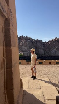 tourist explores nile river cruise to philae temple