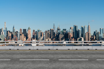 Empty urban asphalt road exterior with city buildings background. New modern highway concrete construction. Concept of way to success. Transportation logistic industry fast delivery. New York. USA.