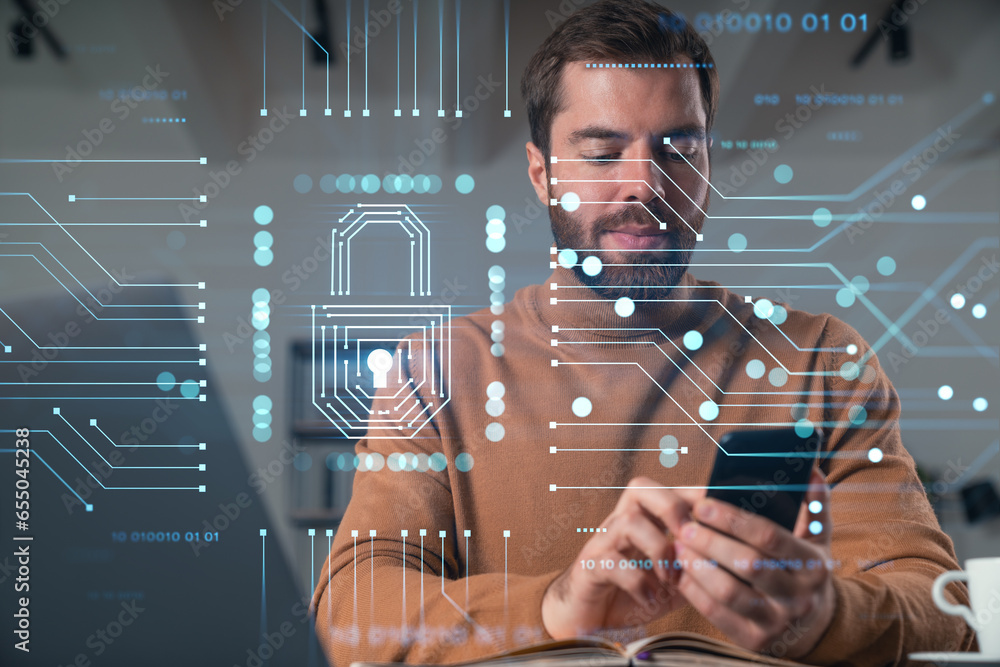Poster handsome businessman working on laptop at office workplace in background. using phone to read text, 